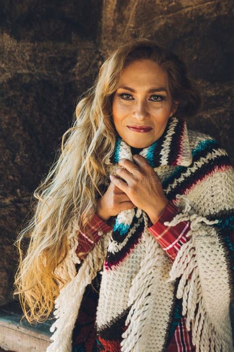 Mature Woman Enjoys A Winter Day In A Stone Cabin With Her Traditional