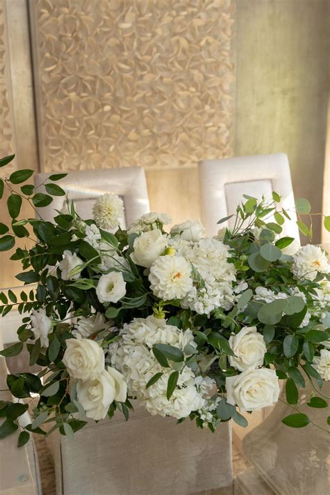 Welcome Table Arrangement Of Whites And Greenery Weddings By Color