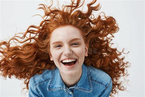 Pretty Cheerful Redhead Girl With Flying Curly Hair Smiling Laughing Looking At Camera Over