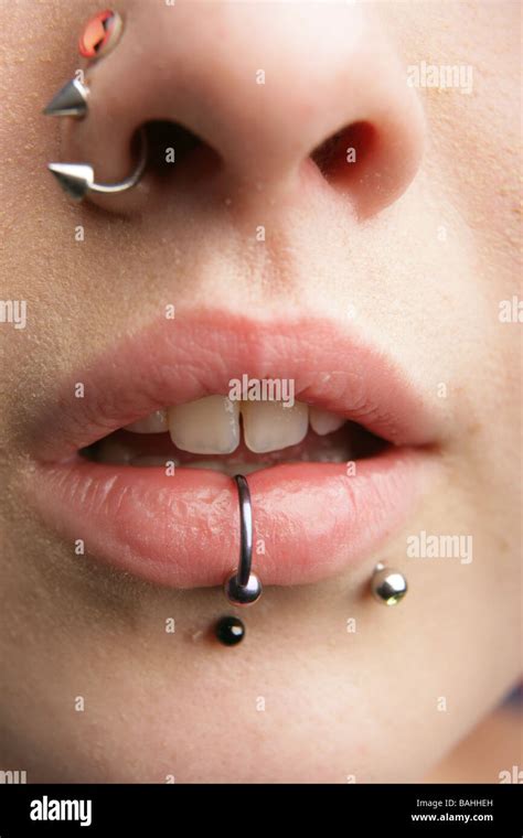 Close Up Of Pierced Female Lips With Vertical Labret Piercing Or Lip Ring Stock Photo By Buecax