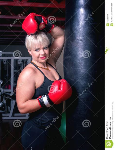 Beautiful Smiling Woman With The Red Boxing Gloves Next