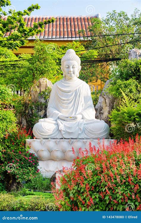 Buddha Statue In Beautiful Garden At Hoi An Ancient Town Stock Photo