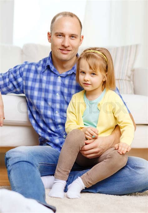 Smiling Father And Daughter Sitting On The Floor Stock Image Colourbox