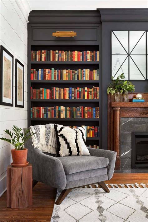 A Living Room Filled With Furniture And Bookshelves Next To A Fire Place In Front Of A Fireplace