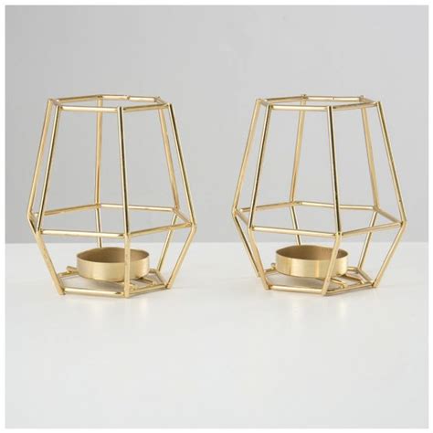 $109.99 ($55.00 per item) free shipping. Pair of Geometric Gold Tea Light Candle Holders