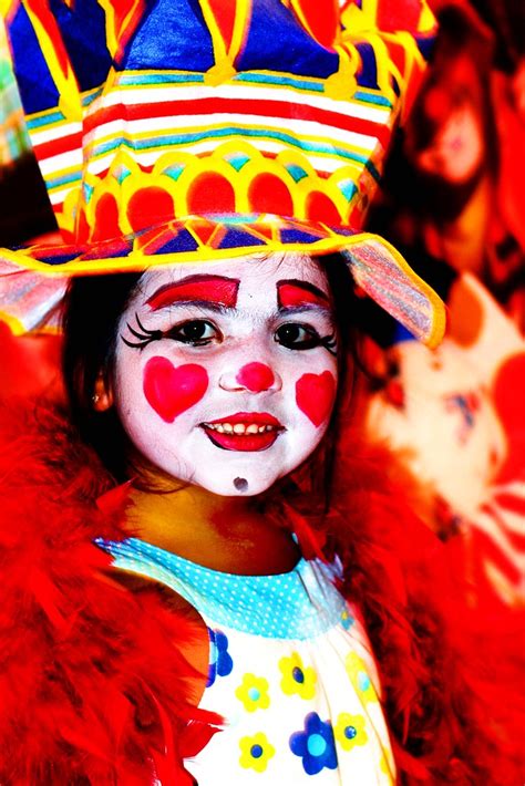 Little Girl Getting Clown Face At The Circus A Photo On