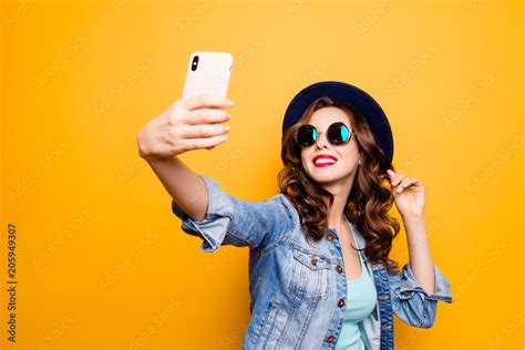 Portrait Of Cool Cheerful Girl Having Video Call With Lover Holding