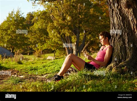 Woman Sitting Under Oak Tree Hi Res Stock Photography And Images Alamy