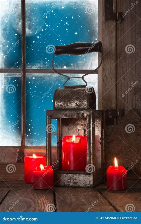 Christmas Atmosphere Four Red Burning Candles In The Window Stock