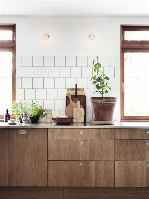 That makes black kitchen cabinets look right at home in this sort of spaces. decordots: Wooden kitchen cabinets and concrete floor