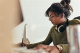 Female computer programmer working at her desk (155969) - YouWorkForThem