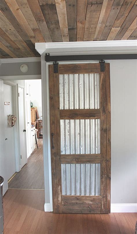 The door is made from pallet wood, and the track is made from scooter wheels and flat a few of these barn door ideas got my wheels turning! 21 DIY Barn Door Projects For An Easy Home Transformation