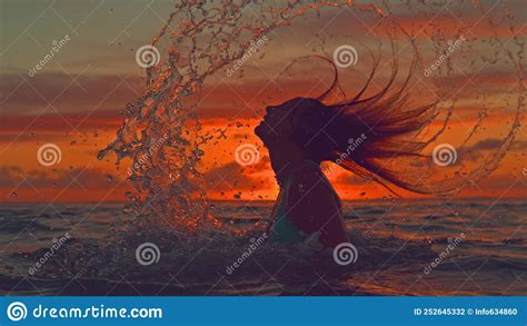 Silhouette Unrecognizable Woman Flips Her Long Hair Back And Sprays