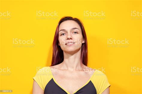 Studio Portrait Of A 30 Year Old Woman With Purple Hair In A Leotard On