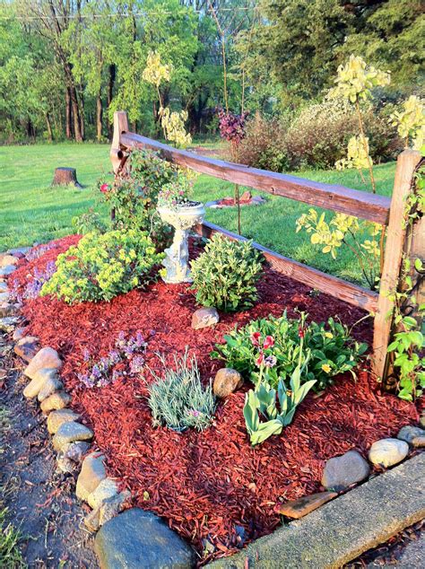 How to use a power auger; Front fence garden. | Front flower beds, Landscaping with ...