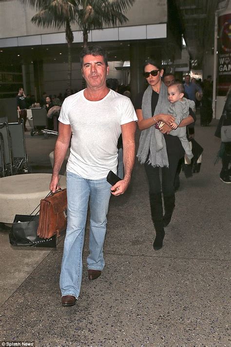 simon cowell leads girlfriend lauren silverman and son eric through lax airport daily mail online