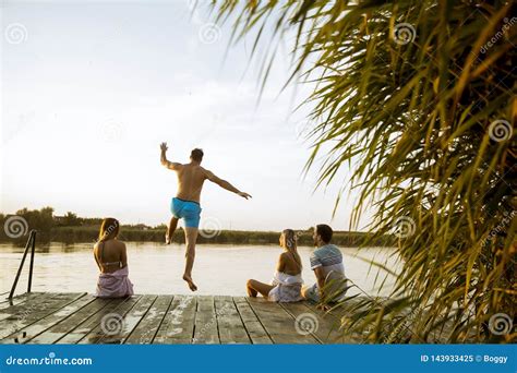 People Having Fun At The Lake On A Summer Day Stock Image Image Of Scene Pier