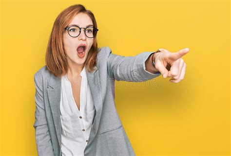 Young Caucasian Woman Wearing Business Style And Glasses Pointing With