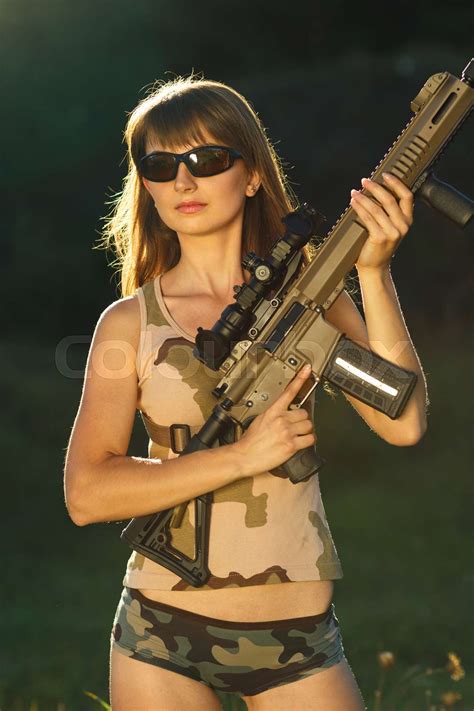 Young Beautiful Girl With A Shotgun In An Outdoor Stock Image Colourbox