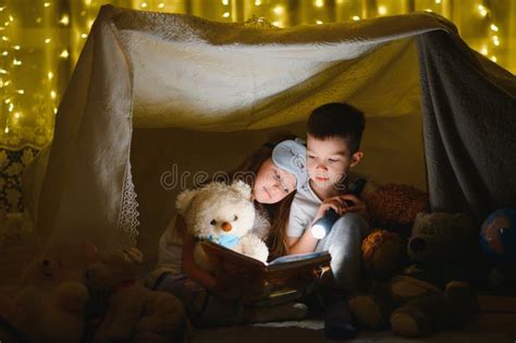 Little Children Reading Bedtime Story At Home Stock Image Image Of