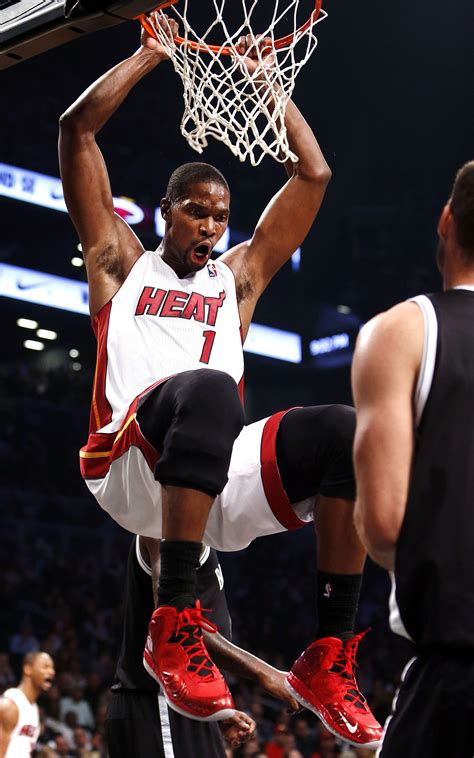 miami heat s chris bosh celebrates after dunking the ball against the brooklyn nets during an