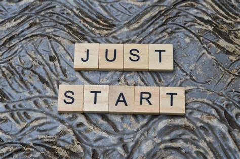 Just Start Text On Wooden Square Motivation Quotes Stock Photo