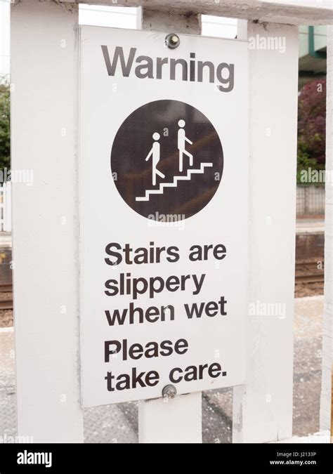A Warning Sign Saying Stairs Are Slippery When Wet Please Take Care