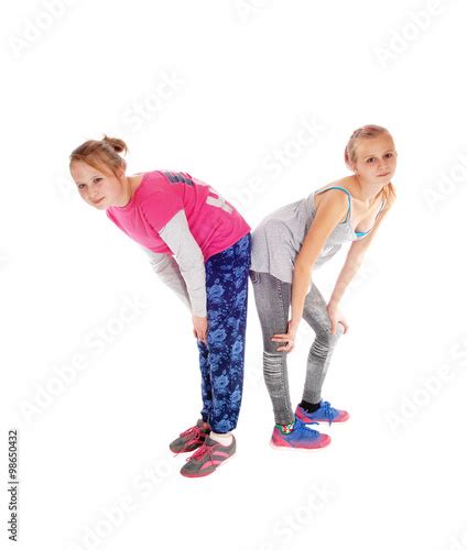 Two Sisters Standing Butt On Butt Buy This Stock Photo And Explore