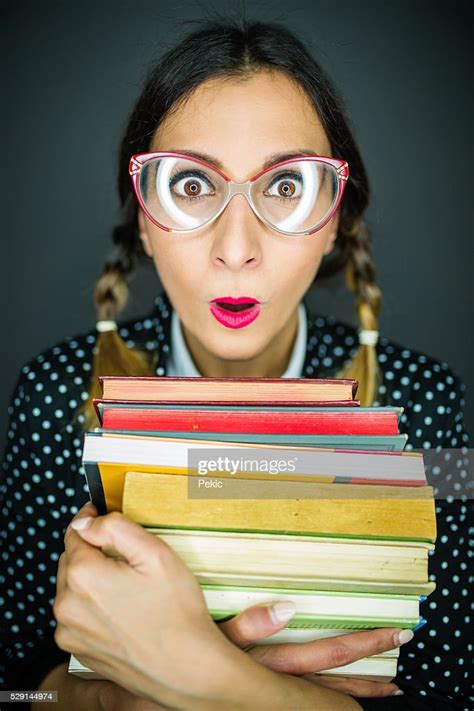 Scared Nerd Girl With Big Glasses Holding Books High Res Stock Photo