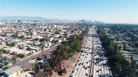 Aerial Los Angeles Freeway Traffic Driving California City Drone Stock
