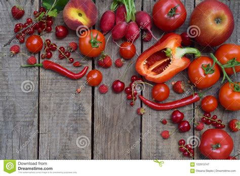 Red Fruits And Vegetables On Wooden Background Apples Tomatoes