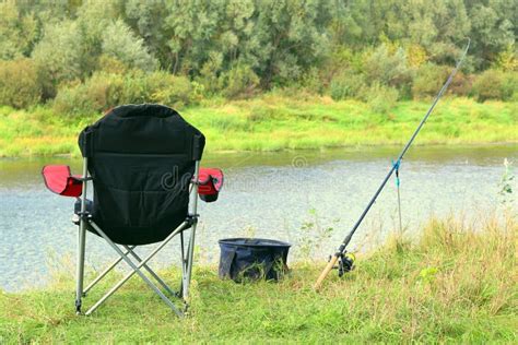 Fishing Chair Rod And Bait On The River Bank Stock Image Image Of