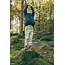 Little Boy Standing On Tree Stump Reaching Up High Res Stock Photo 
