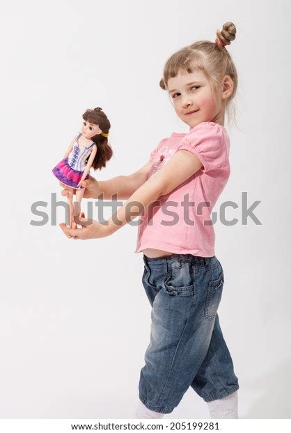 Smiling Little Girl Holding Doll Studio Stock Photo 205199281