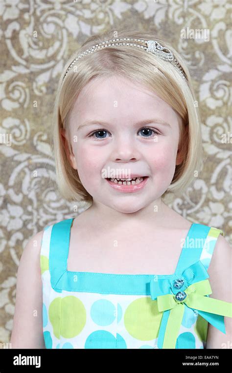 Beautiful Little Girl Posing For Camera In Studio Stock Photo Alamy