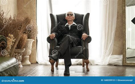 Senior Asian Man Handsome And Suit Sitting In Rich Expensive House