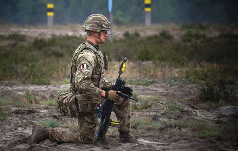A Soldier From 2 Mercian Pauses For A Moment On Exercise In Poland