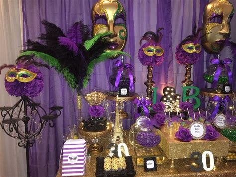 birthday masquerade party candy buffet in purple green black and gold mardi gras party