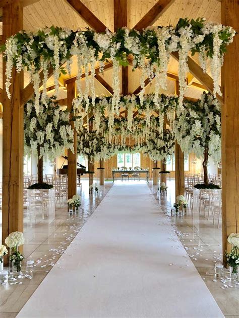 Choose spots that the nail will fit snugly in order to support the weight of the garland. Hanging Garlands for Wedding Hire - Uplit Event Hire