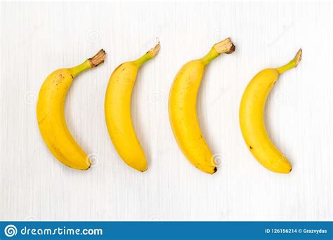 Four Fresh Bananas On Wooden Table Stock Photo Image Of Exotic Fruit
