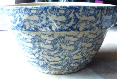 A Blue And White Bowl Sitting On Top Of A Table