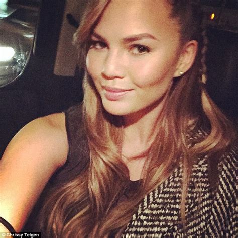 Chrissy Teigen Displays Her Thin Pins In Skintight Trousers As She