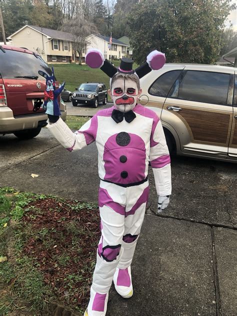 A Person In A Costume Standing On The Sidewalk