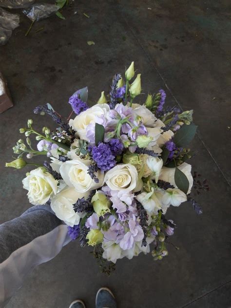 white and purple bridal bouquet using roses carnations stock statice dried lavender