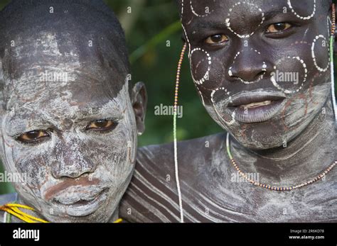 Surma Man And Surma Boy With Body Painting Face Painting Kibish Omo Valley Ethiopia Stock