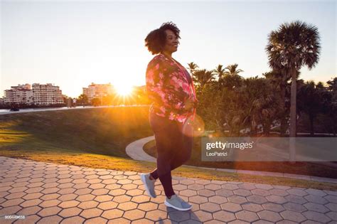Curvy Young Black Woman Walking Jogging And Running In The City Public