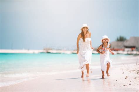 Beautiful Mother And Daughter At Caribbean Beach Enjoying Summer Vacation Stock Image Image