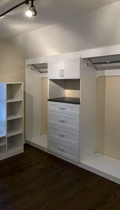 Sloped Ceiling Closet Design With Hanging Shelves And Closet Drawers