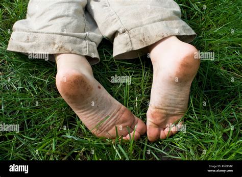 A Little Boys Dirty Feet In The Grass 3 5 Years Old Stock Photo Alamy