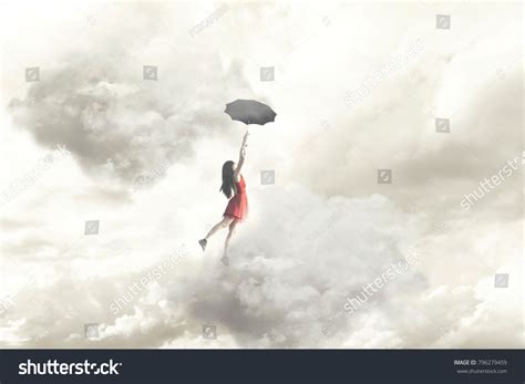 Surreal Moment Of An Elegant Woman Flying In The Middle Of The Clouds